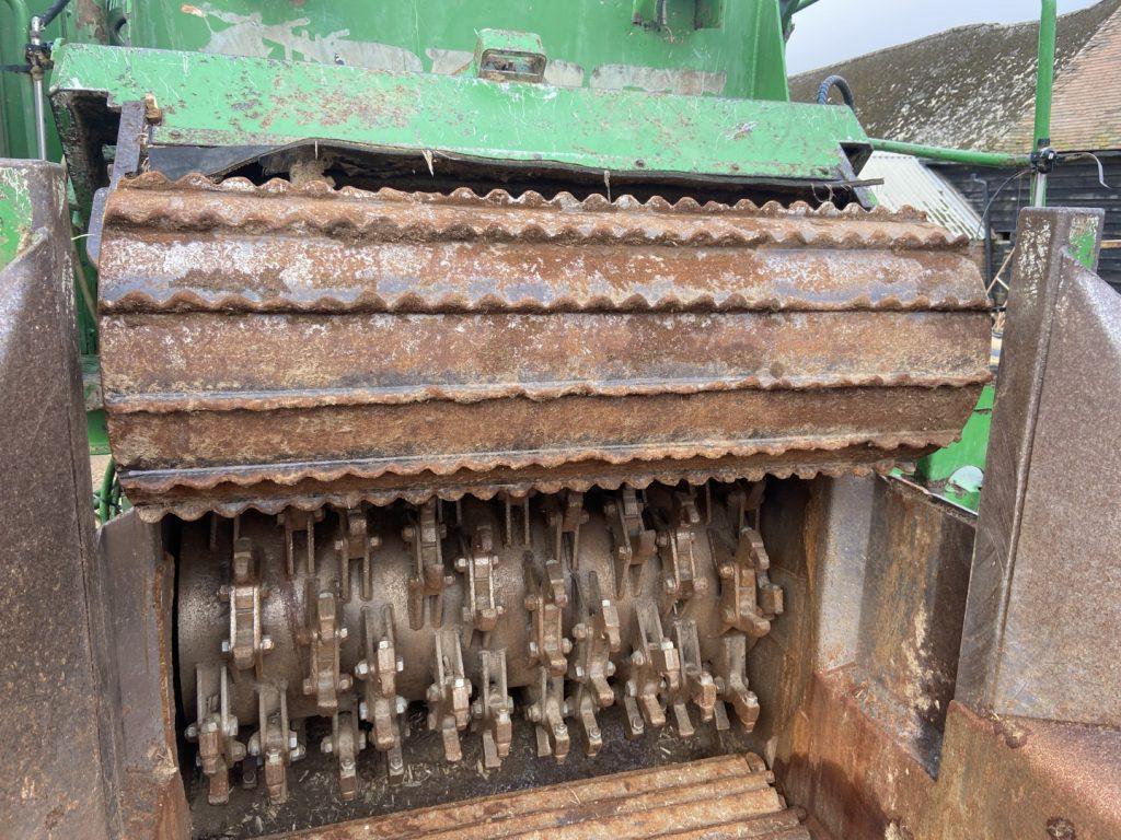 Inspection of a used shredder, mouth opened to inspect the wear