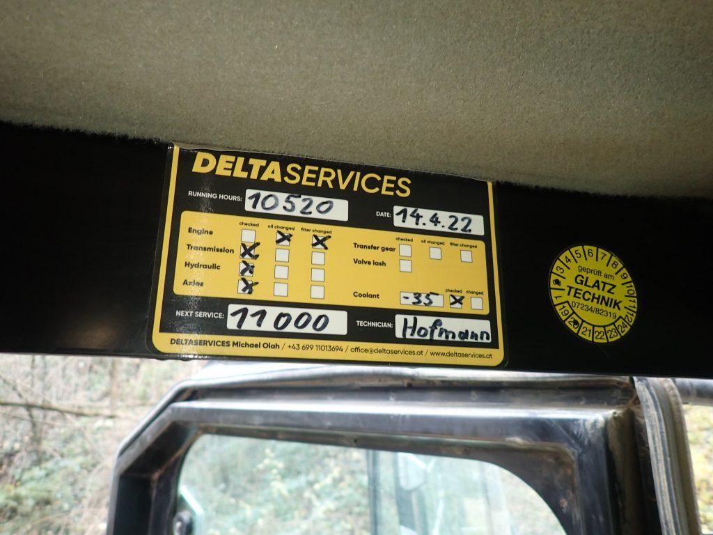 Sticker with service information for heavy equipment maintenance