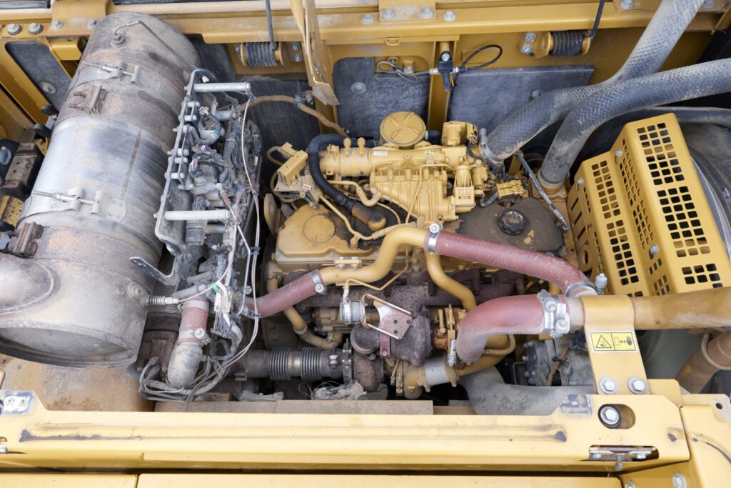 engine of an excavator, inspected for blow by, oil condition and coolant