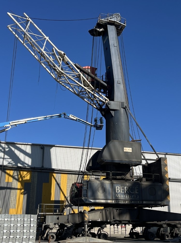 Liebherr Harbor crane with broken boom in a port